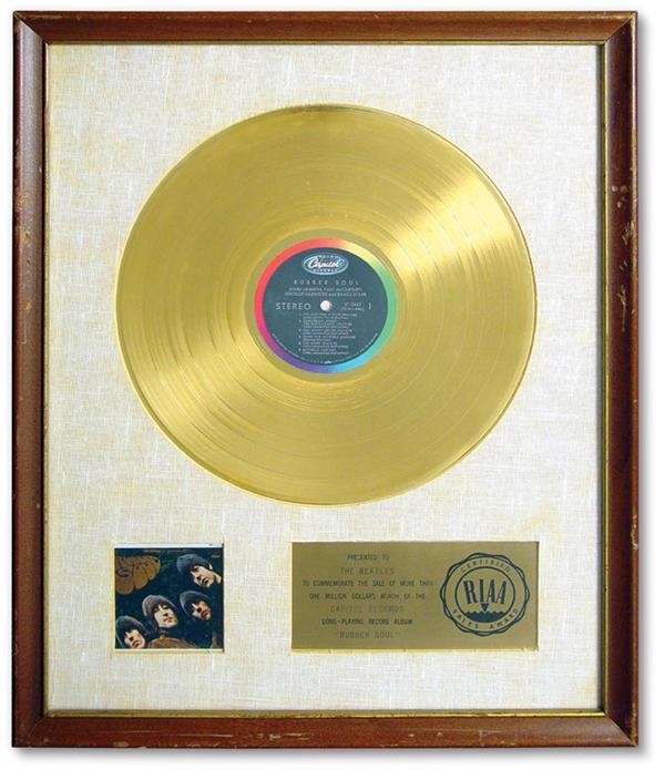 - 1965 "Rubber Soul" Gold Record Award (18x22")