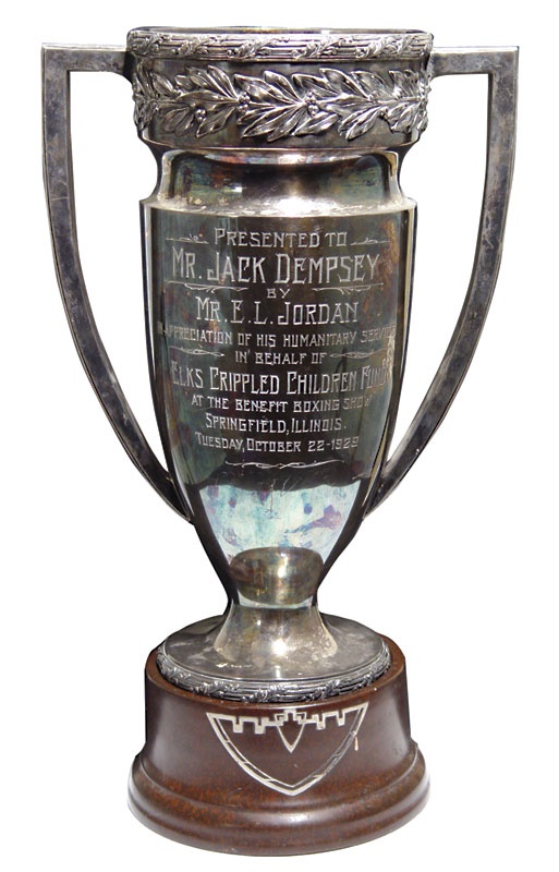 - Jack Dempsey's 1929 Crippled Children Trophy (19" tall)