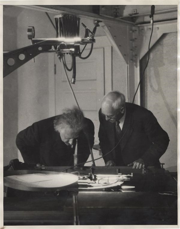 Einstein Looks at Proof of Relativity (1931)