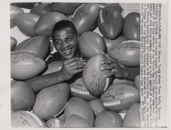 Ernie Davis Signs All-American Footballs (1961)