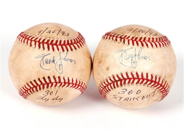 Baseball Autographs - Randy Johnson Autographed Game Used 300 Strikeout Baseball and 301 Strikeout Baseball (2)