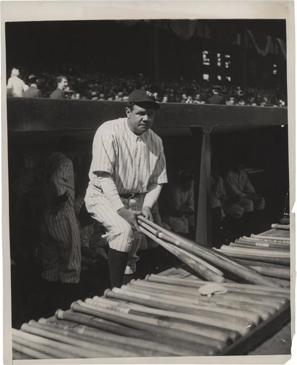 - Babe Ruth Looks Over his Bats Photograph (1931)