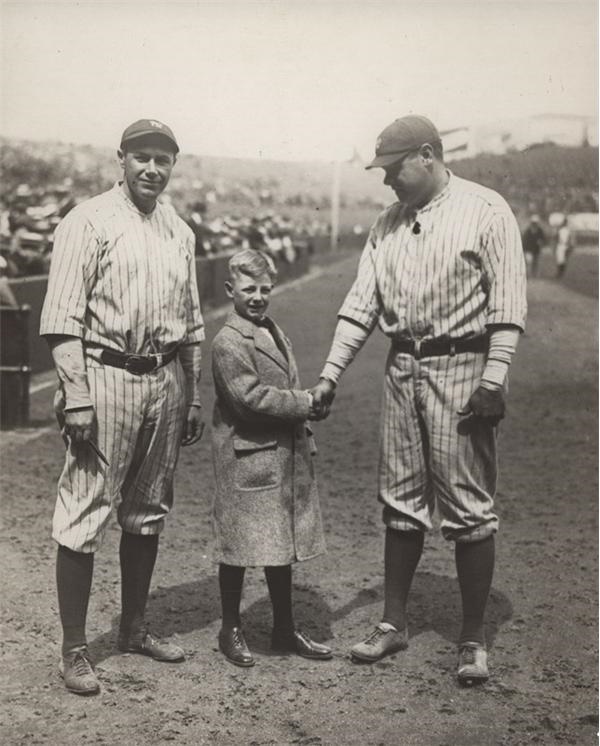 - Babe Ruth Shakes Hand with Child (1920's)