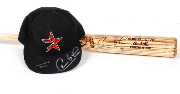 Baseball Equipment - 2007 Carlos Lee Game Used Autographed Bat and 2007 Game Used Signed Hat