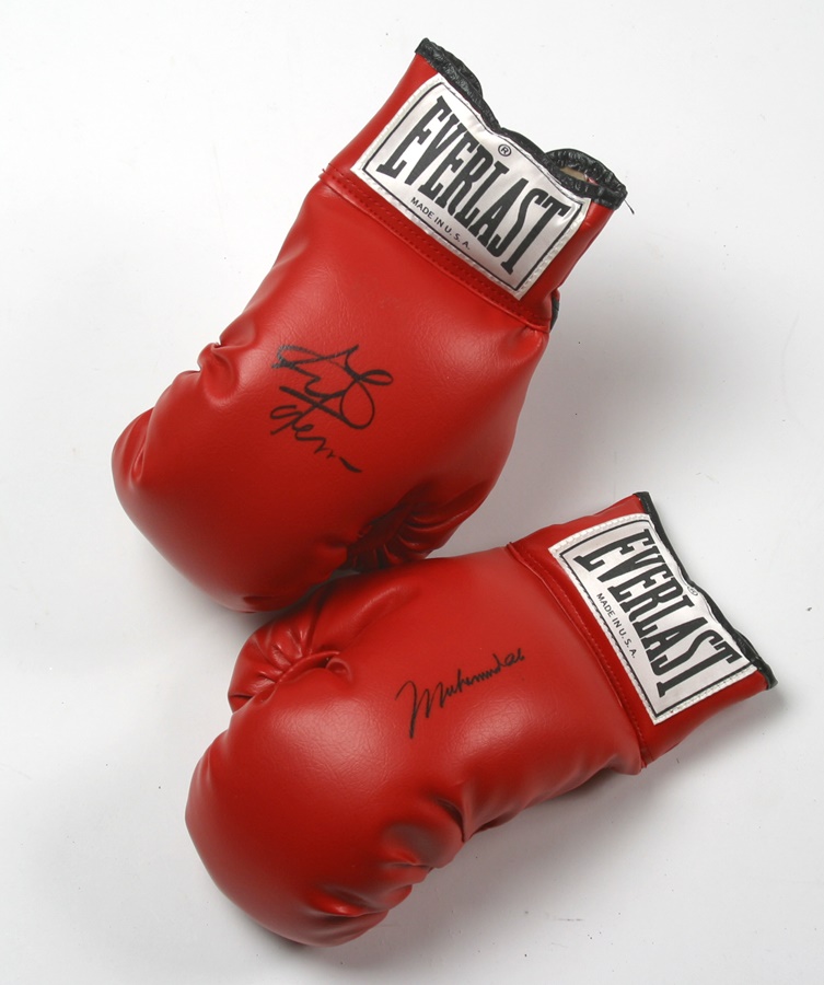 Muhammad Ali & Boxing - Muhammad Ali and George Foreman Signed Boxing Gloves