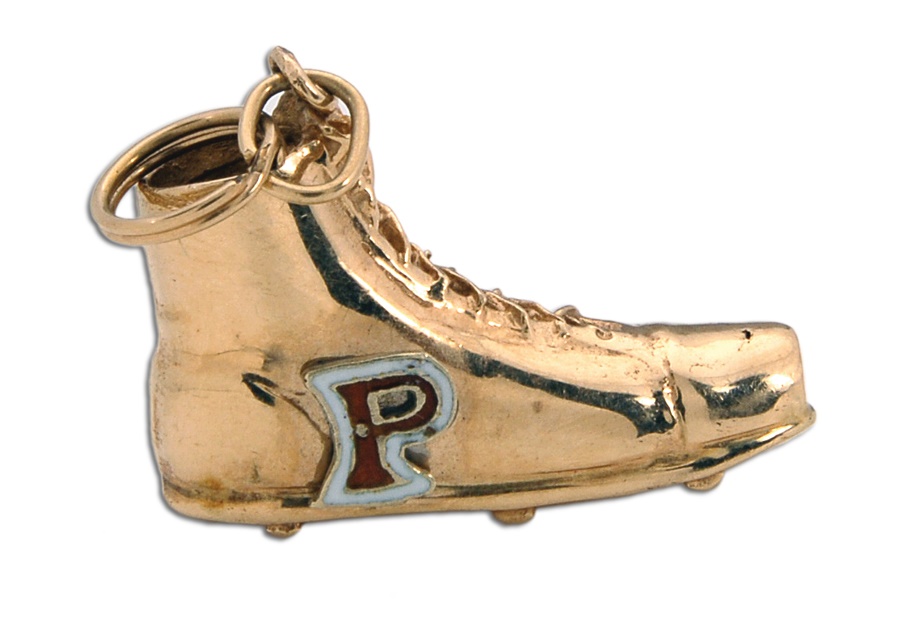 - The Symbolic Golden Shoe Pendant Presented to Team Members