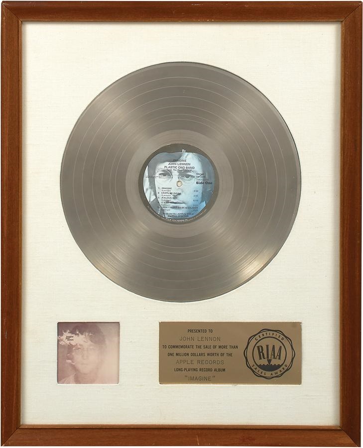 - John Lennon "Imagine" White Matte Gold Record Presented to John Lennon