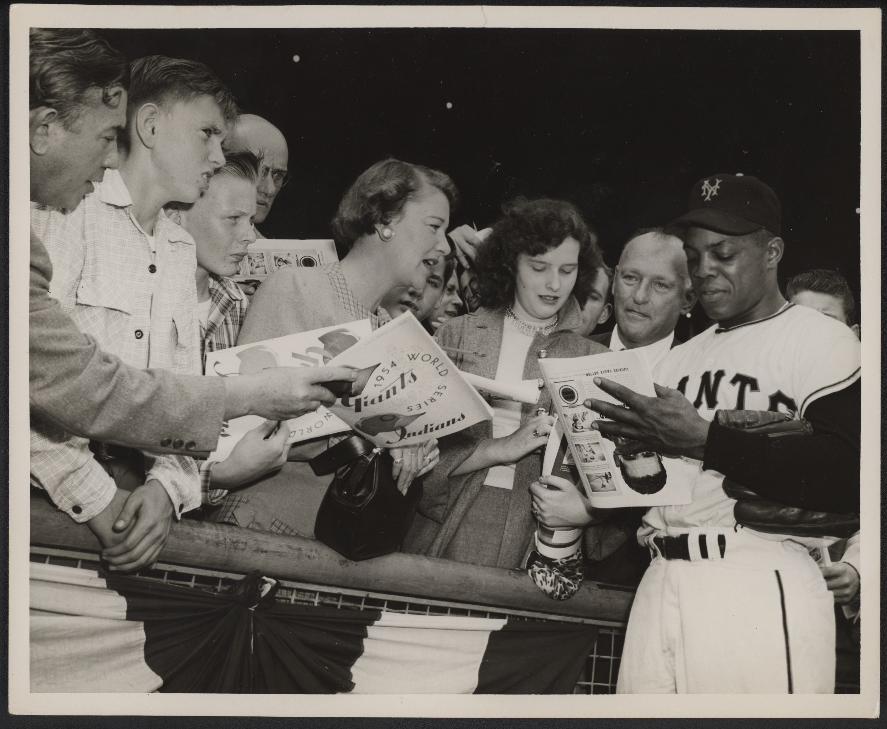 - 1954 Willie Mays Signs Autographs at World Series Type I Press Photo