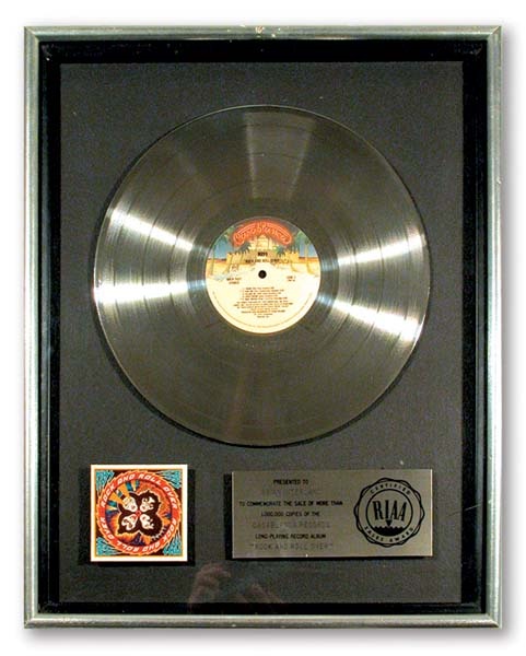 - KISS "Rock And Roll Over" Platinum Record Award