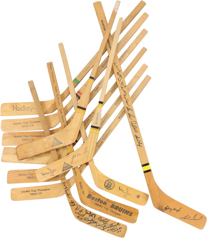 - Boston Bruins and Bobby Orr Mini-Sticks (12)