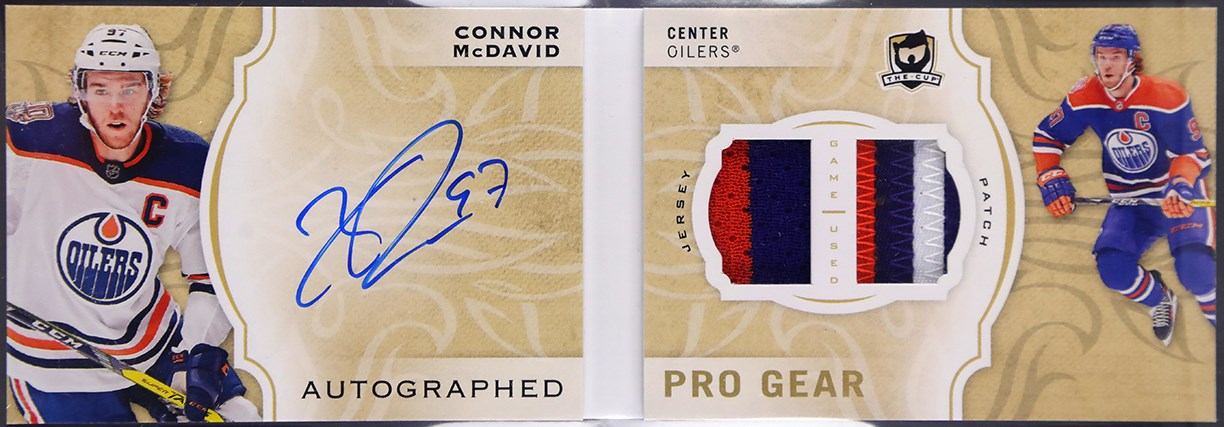 - 2018-19 The Cup Connor McDavid Pro Gear Dual Patch Autograph Booklet 1/12 BGS NM-MT 8.5 Auto 9