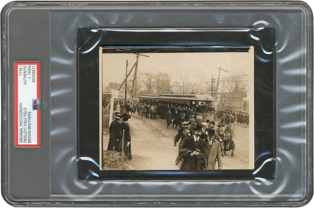 The Brown Brothers Collection - Fans Arrive on Field Trolley for Football Game Photograph (PSA Type I)