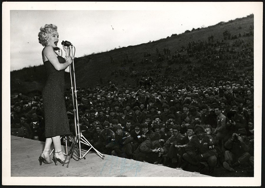 - 1954 Marilyn Monroe Sings on Stage at the USO Show Photograph - Secretarially Signed (PSA Type I)