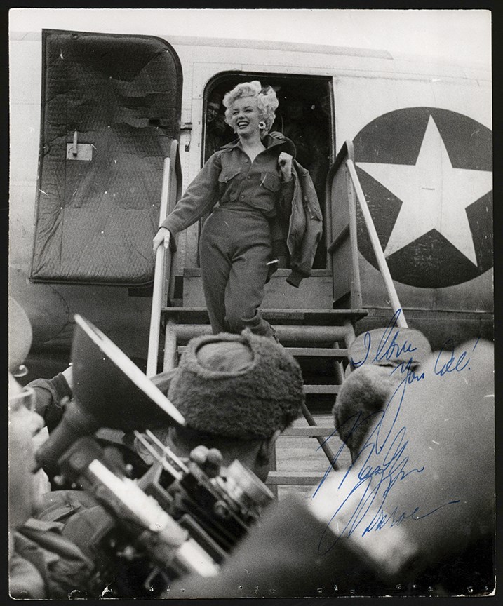 - 1954 Marilyn Monroe Exits the Plane for Her USO Show Photograph - Secretarially Signed (PSA Type II)