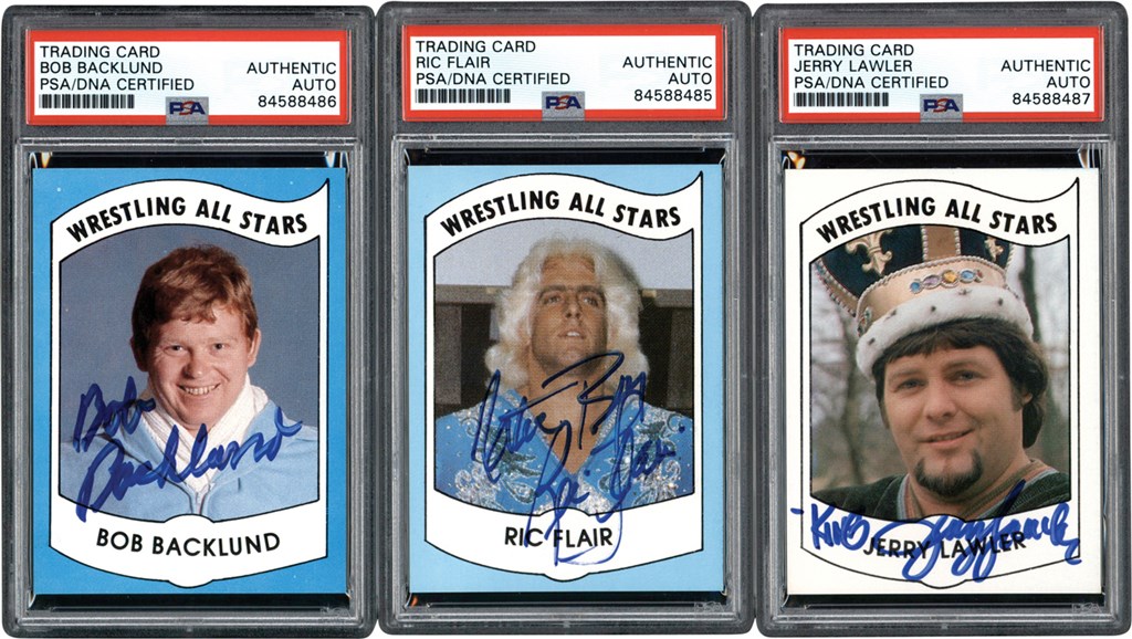 1982 Wrestling All Stars Autographed Card Trio w/Rick Flair, Lawler, & Backlund (All PSA)