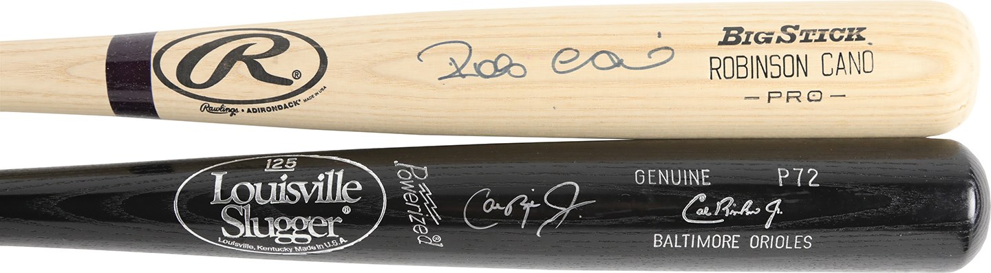 Baseball Autographs - Cal Ripken and Robinson Cano Autographed Bats