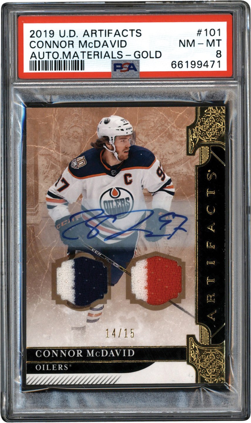 - 2019-2020 Upper Deck Artifacts Auto Materials Gold #101 Connor McDavid Dual Game Used Patch Autograph #14/15 PSA NM-MT 8 (Pop 1 of 1 Highest Graded)