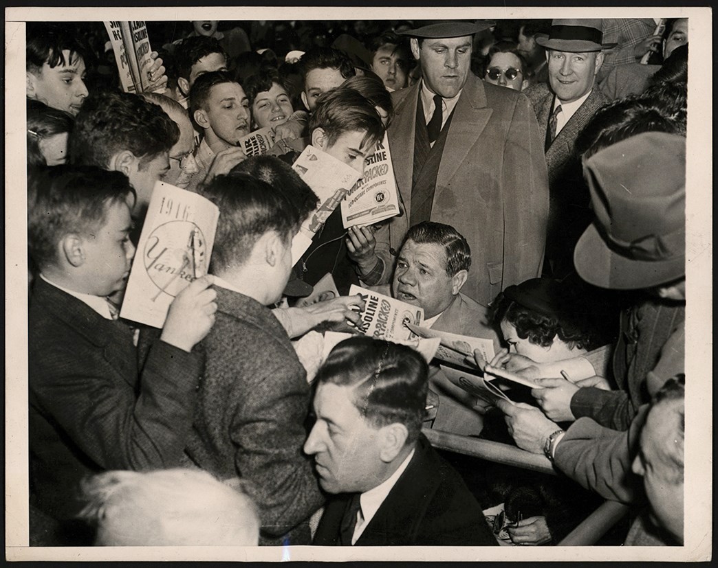 - 1946 Babe Ruth "Signing Autographs" Photo (PSA Type I)