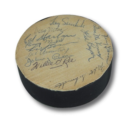 - 1956-58 Boston Bruins Team Signed Puck with Terry Sawchuk