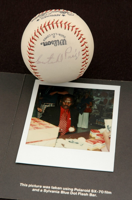 Baseball Autographs - Satchel Paige Single Signed Baseball With Photo Of Him Signing