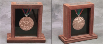 - 1988 Winter Olympics Gold Medal Salesman's Sample
