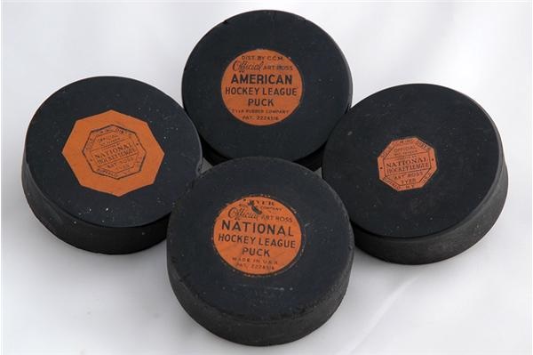 - Four Vintage Game Used  Hockey Pucks