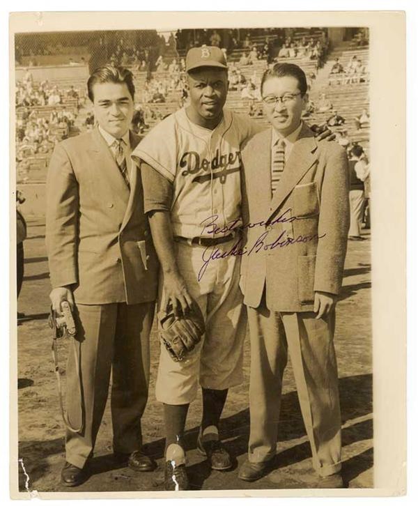 Autographs Baseball - Jackie Robinson Signed Photo on 1956 World Tour