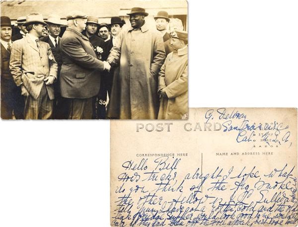 - Jack Johnson Shaking Hands with John L. Sullivan Real Photo Postcard
