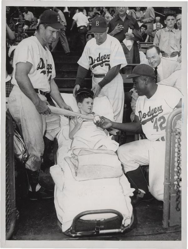 Memorabilia Baseball Photographs - Singles - Jackie Robinson Gives Comfort to Injured Child (1952)