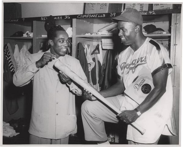 - Jackie Robinson wearing Dodgers Satin Uniform Photograph
