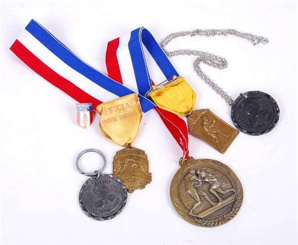 - Cassius Clay/Muhammad Ali Related Medals and Key Chains (6)
