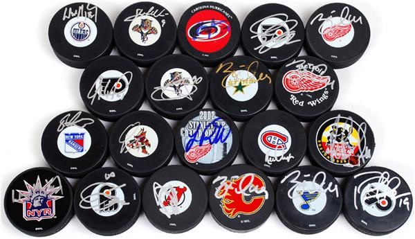 - Large Signed Hockey Puck Collection w/ Gretzky, Lemieux, Bourque, and Hull (50+)