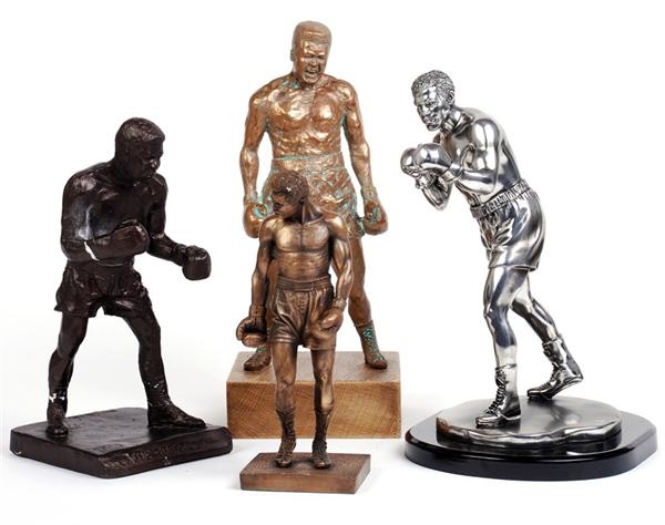 Memorabilia Boxing - Collection of Muhammad Ali Statues (4)