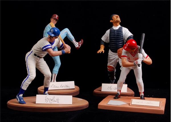 Baseball Autographs - Pete Rose, George Brett, Yogi Berra, Steve Carlton Signed Gartlan Statues (4)