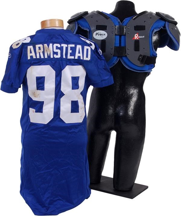 - 2001 Jessie Armstead Game Used Jersey and Shoulder Pads (2)