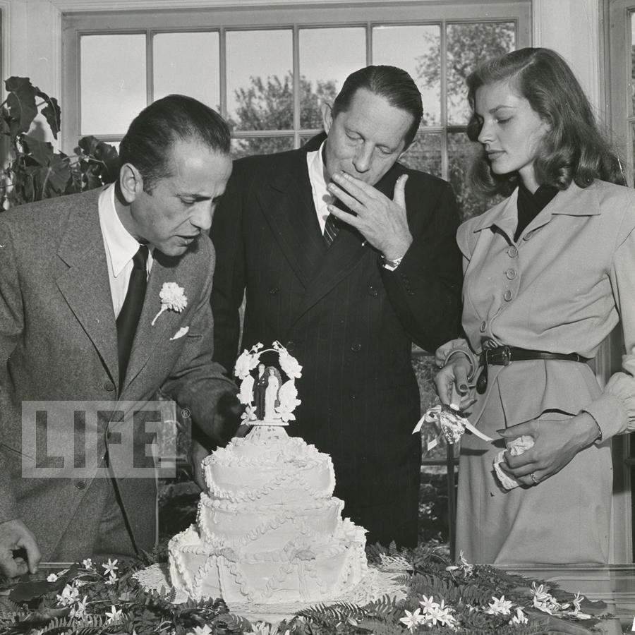 - Humphrey Bogart and Loren Bacall Cut Their Wedding Cake by Ed Clark (1912 - 2000)