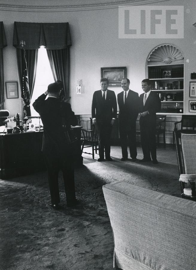 - John F. Kennedy with His Brother in the Oval Office by Art Rickerby