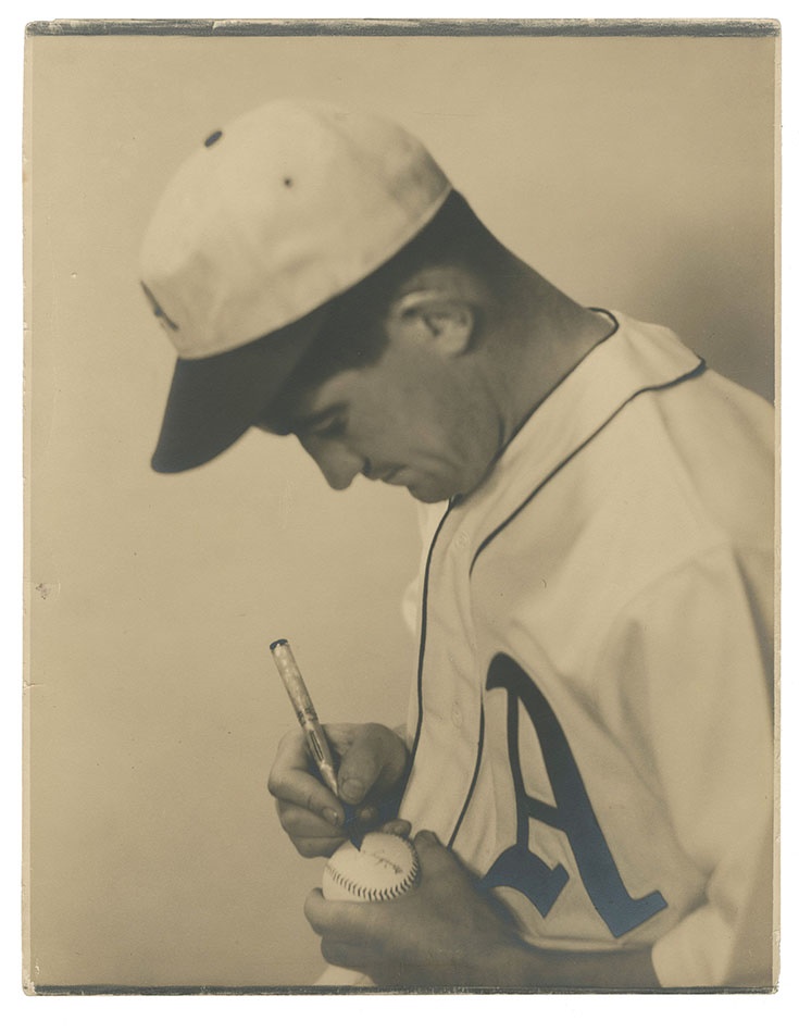 The Mickey Cochrane Collection - Mickey Cochrane Signs a Baseball Photo