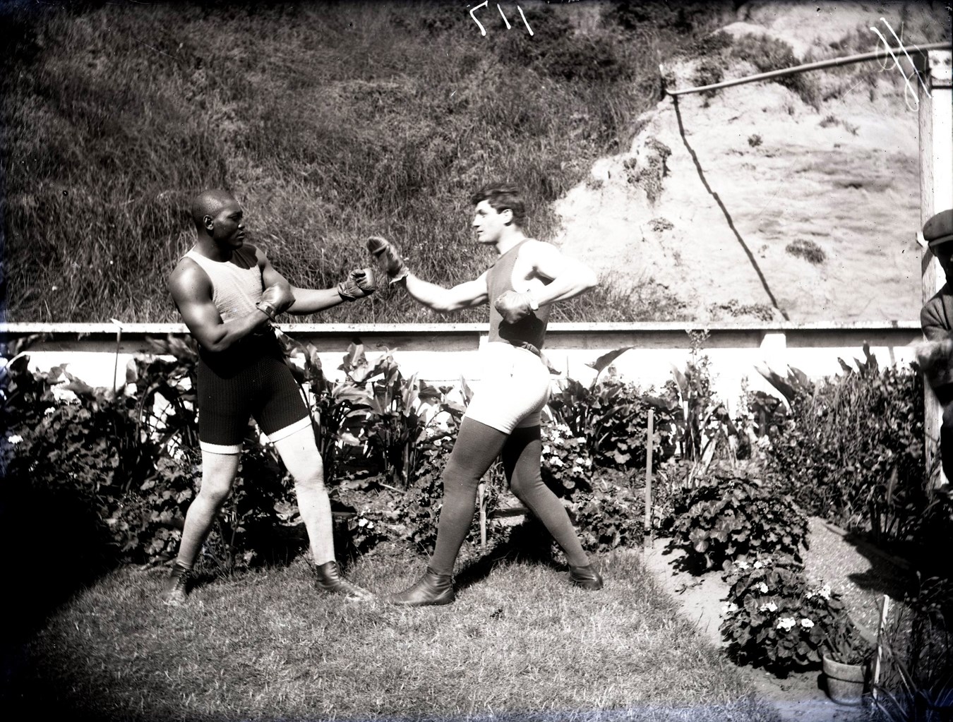 Dana Collection Of Important Boxing Negatives - 1909 Jack Johnson Spars w/Jewish Boxer Al Kaufman "Outside in Garden Setting" Type I Glass Plate Negative by Dana Studios