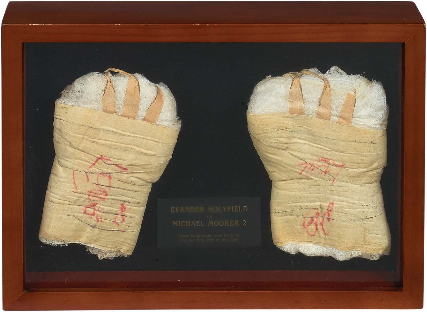 - Evander Holyfield Fight Worn Hand Wraps (1997-Moorer Title Unification)