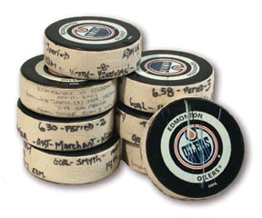 Collection of 2001-02 NHL Goal Pucks inc. Sakic & Yzerman (8)