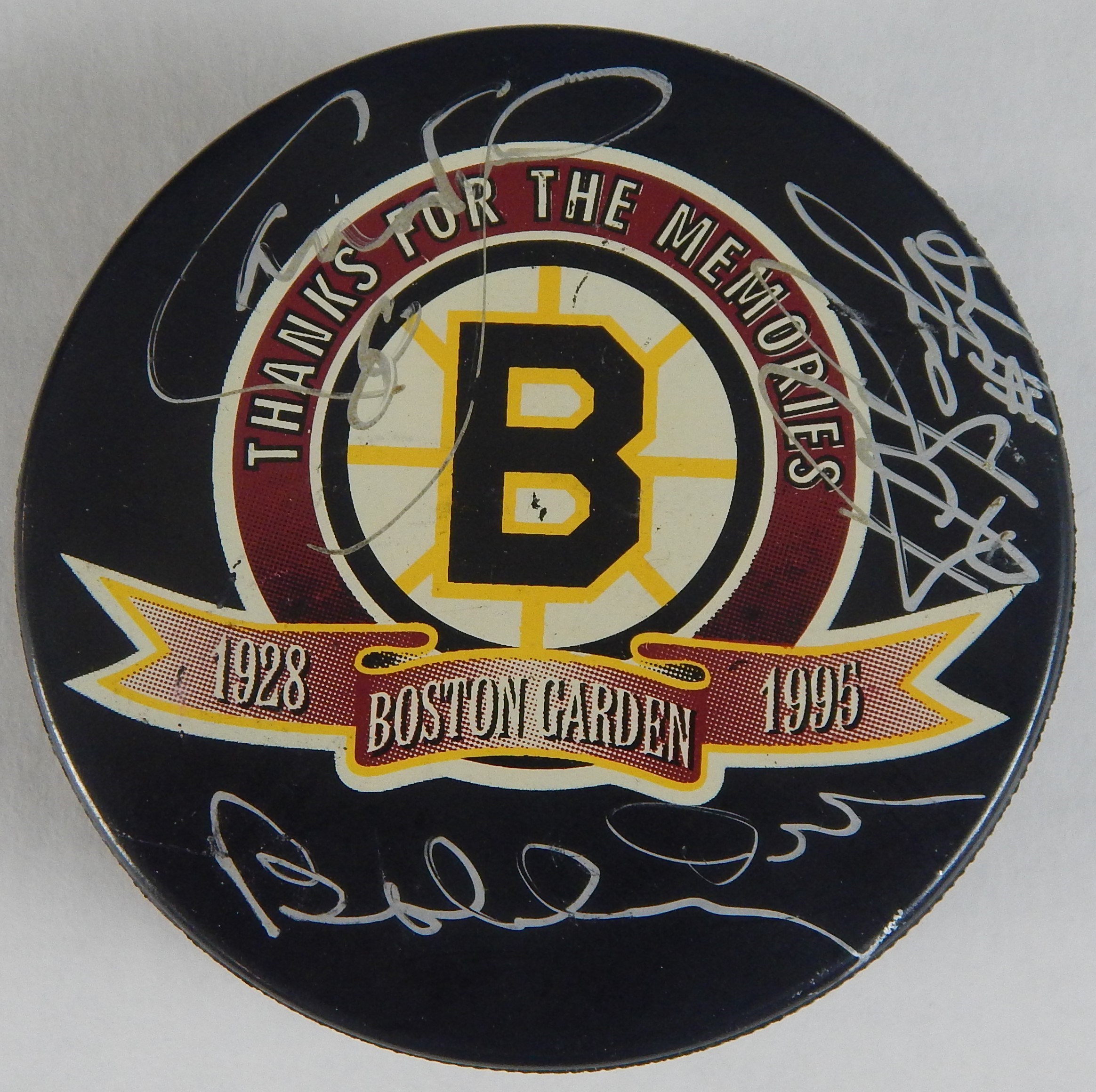 Hockey - Three Boston Bruins Legends Signed Puck (Orr, Bourque, Neely)